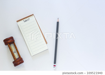 Time management concept, to do list with notepad and black pencil on white desk. 109521940