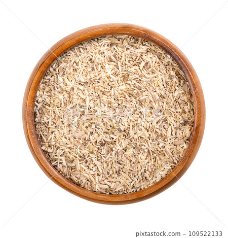 Dried cut Siberian ginseng root in a wooden bowl. Eleutherococcus senticosus, also called eleuthero or devils bush. Extracts are used in traditional Chinese medicine as dietary supplement or cosmetic. 109522133