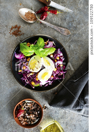 Cabbage salad with corn and boiled egg. 109522780