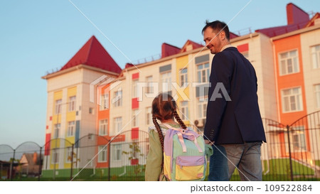 father leads girl daughter by hand school, family, school education building first-grader child, backpack children's knowledge, little child kid girl daughter, daddy little schoolgirl going class father leads girl daughter by hand school, family, school education building first-grader child, backpack children's knowledge, little child kid girl daughter, daddy little schoolgirl going class 109522884