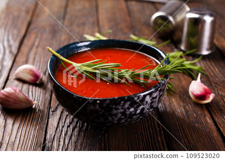 traditional spanish cold soup puree gaspacho or gazpachoon a dark background. traditional spanish cold soup puree gaspacho or gazpachoon a dark background. 109523020