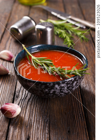 traditional spanish cold soup puree gaspacho or gazpachoon a dark background. 109523026