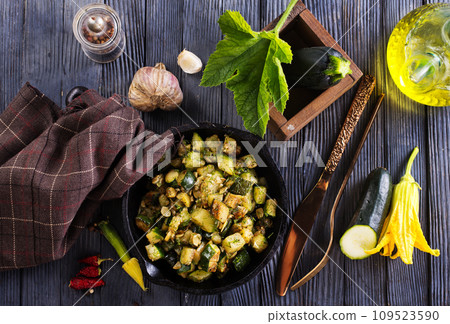 Sliced spiced zucchini with oil, salt and garlic Sliced spiced zucchini with oil, salt and garlic 109523590