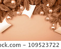 Christmas card with copy space in peach color.  109523722