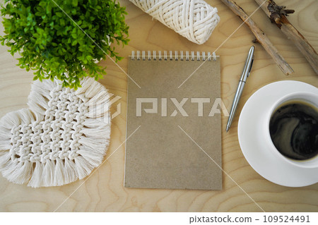 Tools and materials for macrame. Cotton ropes, sticks from the river, grinded by water. Notepad with an empty space for writing. Concept diy. Tools and materials for macrame. Cotton ropes, sticks from the river, grinded by water. Notepad with an empty space for writing. Concept diy. 109524491