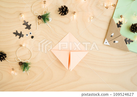 Step 5 origami. Step by-step photo instructions how to make a bookmark in the form of an deer out of paper with your own hands. Simple crafts with children. 109524627