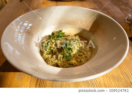 Mushroom Risotto on Elegant Restaurant Plate, Porcini Mushrooms Rissoto, Delicious Italian Risoto Lunch Mushroom Risotto on Elegant Restaurant Plate, Porcini Mushrooms Rissoto, Delicious Italian Risoto Lunch 109524761