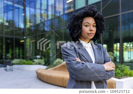 Portrait of business woman serious confident female worker in business suit with wrinkled hands looking at camera accountant financier outside office building. Portrait of business woman serious confident female worker in business suit with wrinkled hands looking at camera accountant financier outside office building. 109525712
