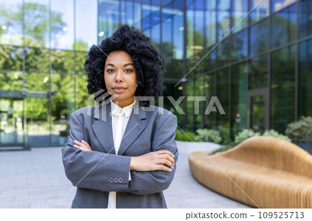 Portrait of business woman serious confident female worker in business suit with wrinkled hands looking at camera accountant financier outside office building. Portrait of business woman serious confident female worker in business suit with wrinkled hands looking at camera accountant financier outside office building. 109525713