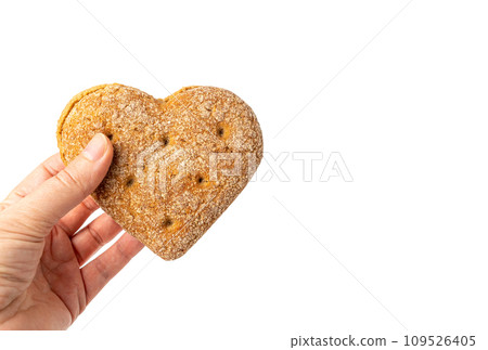 Oatmeal Bun in the Shape of a Heart Isolated, Gluten Free Flat Finnish Bread Roll 109526405