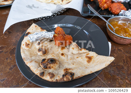 Indian Flat Bread Closeup, Traditional Flatbread also Known as Pita Bread, Roti, Chapati, Naan or Tortilla 109526429
