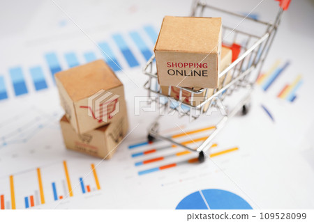 Online shopping, Shopping cart box on business graph, import export, finance commerce. Online shopping, Shopping cart box on business graph, import export, finance commerce. 109528099