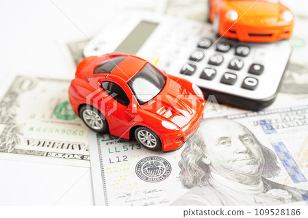 Bangkok, Thailand November 18, 2023 Car on banknote money with calculator, buying or insurance concept. 109528186