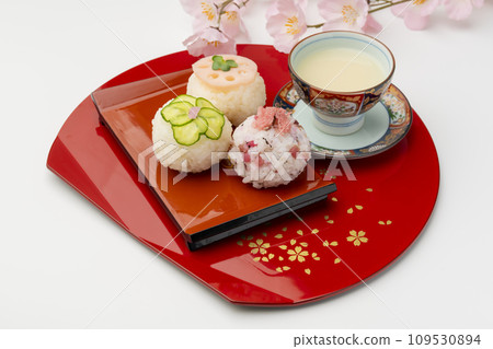 Temari sushi, red tray, sweet sake Temari sushi, red tray, sweet sake 109530894