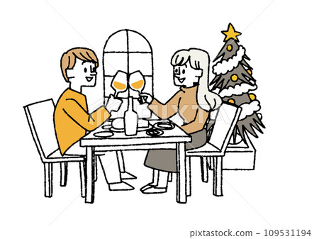 A couple toasting at the dining table. People enjoying a Christmas home party and spending time with their families. 109531194