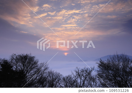 The morning sun rising over a sea of clouds The morning sun rising over a sea of clouds 109531226