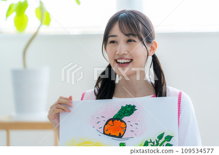 A nursery teacher who plays a picture-story show A nursery teacher who plays a picture-story show 109534577