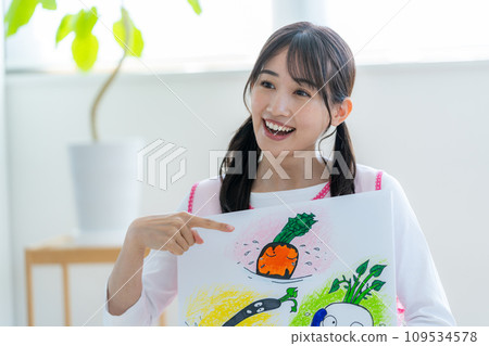 A nursery teacher who plays a picture-story show A nursery teacher who plays a picture-story show 109534578