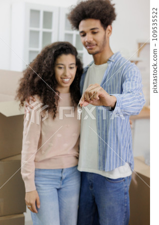 African American man and woman, hold keys in hands and collect personal belongings cardboard boxes African American man and woman, hold keys in hands and collect personal belongings cardboard boxes 109535522