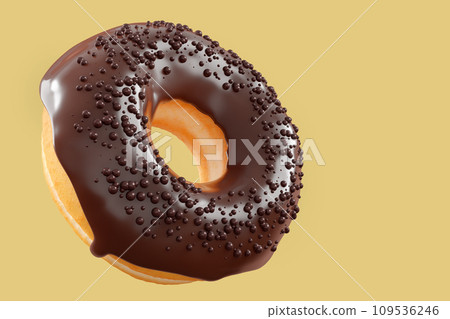 Chocolate glazed donut with sprinkles on a yellow background Chocolate glazed donut with sprinkles on a yellow background 109536246