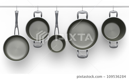 Set of stewpot, frying pan and chrome plated cookware hanging on shelf on white 109536284