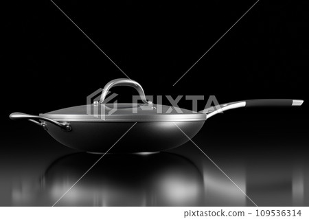 Stainless steel frying pan with glass lid and chrome cookware on black Stainless steel frying pan with glass lid and chrome cookware on black 109536314