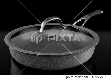 Stainless steel frying pan with glass lid and chrome cookware on black Stainless steel frying pan with glass lid and chrome cookware on black 109536319