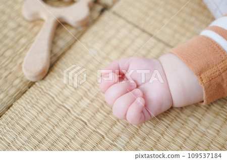 Hands clasped tightly during a nap 109537184