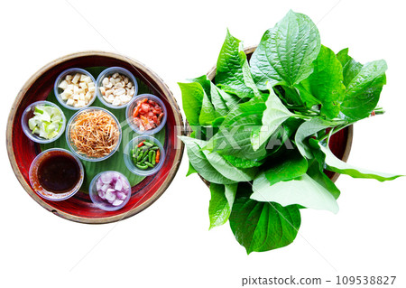 Top view of A royal leaf wrap appetizer, call Miang kham, focus selective Top view of A royal leaf wrap appetizer, call Miang kham, focus selective 109538827