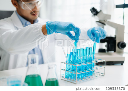 Mmale biotechnologist testing new chemical substances in a laboratory... Mmale biotechnologist testing new chemical substances in a laboratory... 109538870