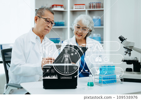 Scientist two Asian senior with tablet, laboratory and ecofriendly science. Agriculture, research and scientists with online reading, test samples for global warming a. with virtual icon Scientist two Asian senior with tablet, laboratory and ecofriendly science. Agriculture, research and scientists with online reading, test samples for global warming a. with virtual icon 109538976