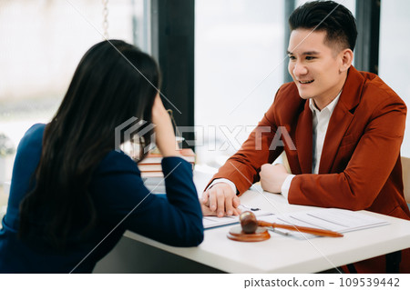 Business people compassionately holding hands and discussing contract papers with laptop and tabletat office room.. 109539442