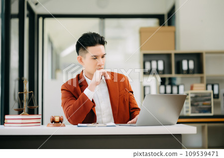justice and law concept.Male judge in a courtroom on wooden table and Counselor or Male lawyer working in office. . 109539471