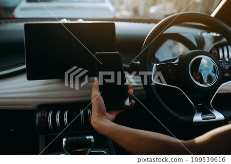 Monitor in EV car with isolated blank screen use for GPS. Isolated on white with clipping path. Car display with blank screen. Modern car interior details.. 109539616