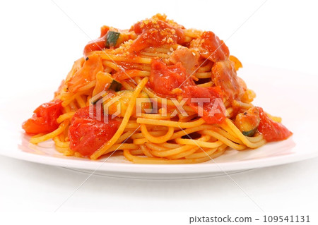 Tomato and zucchini pasta spaghetti bright background Tomato and zucchini pasta spaghetti bright background 109541131