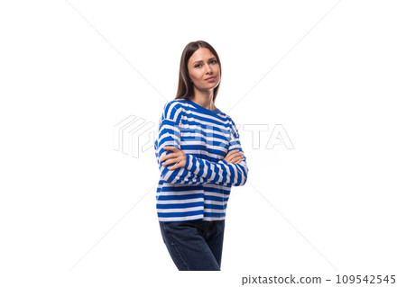 young fashionista brunette woman dressed in a stylish cotton blue blouse on a white background with 109542545
