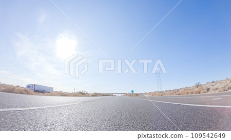 Embarking on a road trip from Nevada to California, driving on Highway 15 during the day offers scenic views and an exciting journey between states. Embarking on a road trip from Nevada to California, driving on Highway 15 during the day offers scenic views and an exciting journey between states. 109542649