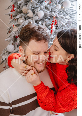 portrait of beautiful couple christmas tree on background portrait of beautiful couple christmas tree on background 109542668