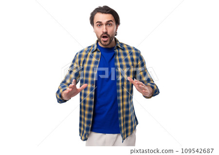 handsome young European brunette man with a well-groomed beard and mustache dressed casually in a handsome young European brunette man with a well-groomed beard and mustache dressed casually in a 109542687
