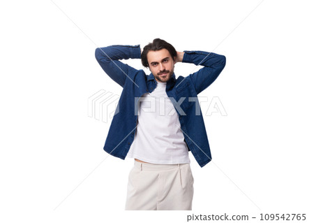 handsome young brunette man in a denim shirt on a white background 109542765