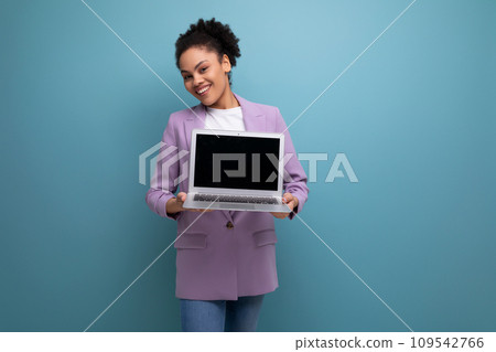young pretty brunette office woman dressed in a jacket demonstrates laptop screen mockup 109542766