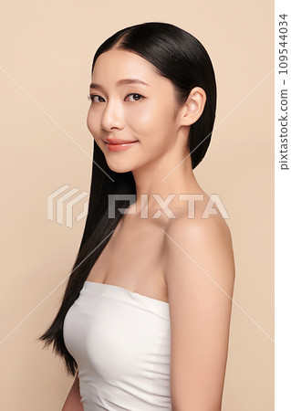 Beautiful young asian woman with clean fresh skin on beige background, Face care, Facial treatment, Cosmetology, beauty and spa, Asian women portrait. Beautiful young asian woman with clean fresh skin on beige background, Face care, Facial treatment, Cosmetology, beauty and spa, Asian women portrait. 109544034