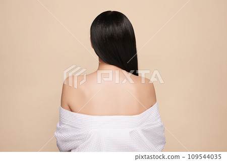 Beautiful young asian woman back view with clean fresh skin on beige background, Face care, Facial treatment, Cosmetology, beauty and spa, Asian 109544035