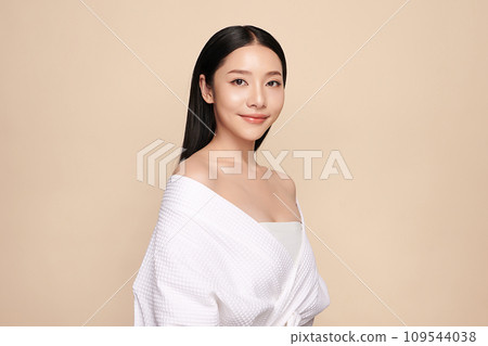 Beautiful young asian woman with clean fresh skin on beige background, Face care, Facial treatment, Cosmetology, beauty and spa, Asian women portrait. Beautiful young asian woman with clean fresh skin on beige background, Face care, Facial treatment, Cosmetology, beauty and spa, Asian women portrait. 109544038