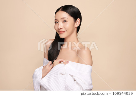 Beautiful young asian woman with clean fresh skin on beige background, Face care, Facial treatment, Cosmetology, beauty and spa, Asian women portrait. Beautiful young asian woman with clean fresh skin on beige background, Face care, Facial treatment, Cosmetology, beauty and spa, Asian women portrait. 109544039