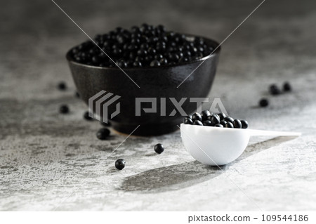 Black beans on gray background Black beans on gray background 109544186