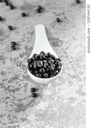 Black beans on gray background Black beans on gray background 109544195
