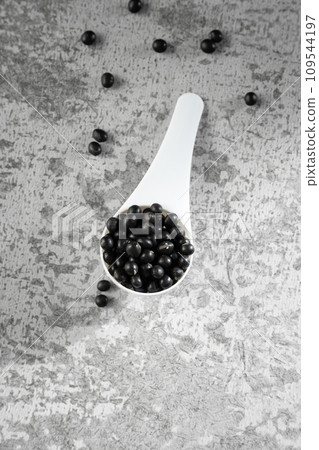 Black beans on gray background 109544197