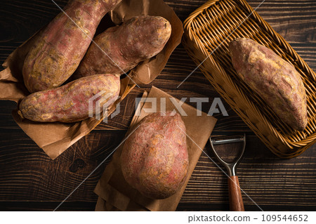 Sweet potatoes on the wooden board Sweet potatoes on the wooden board 109544652