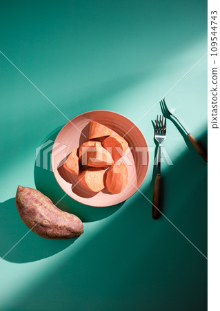 Sweet potatoes on colorful background plate 109544743